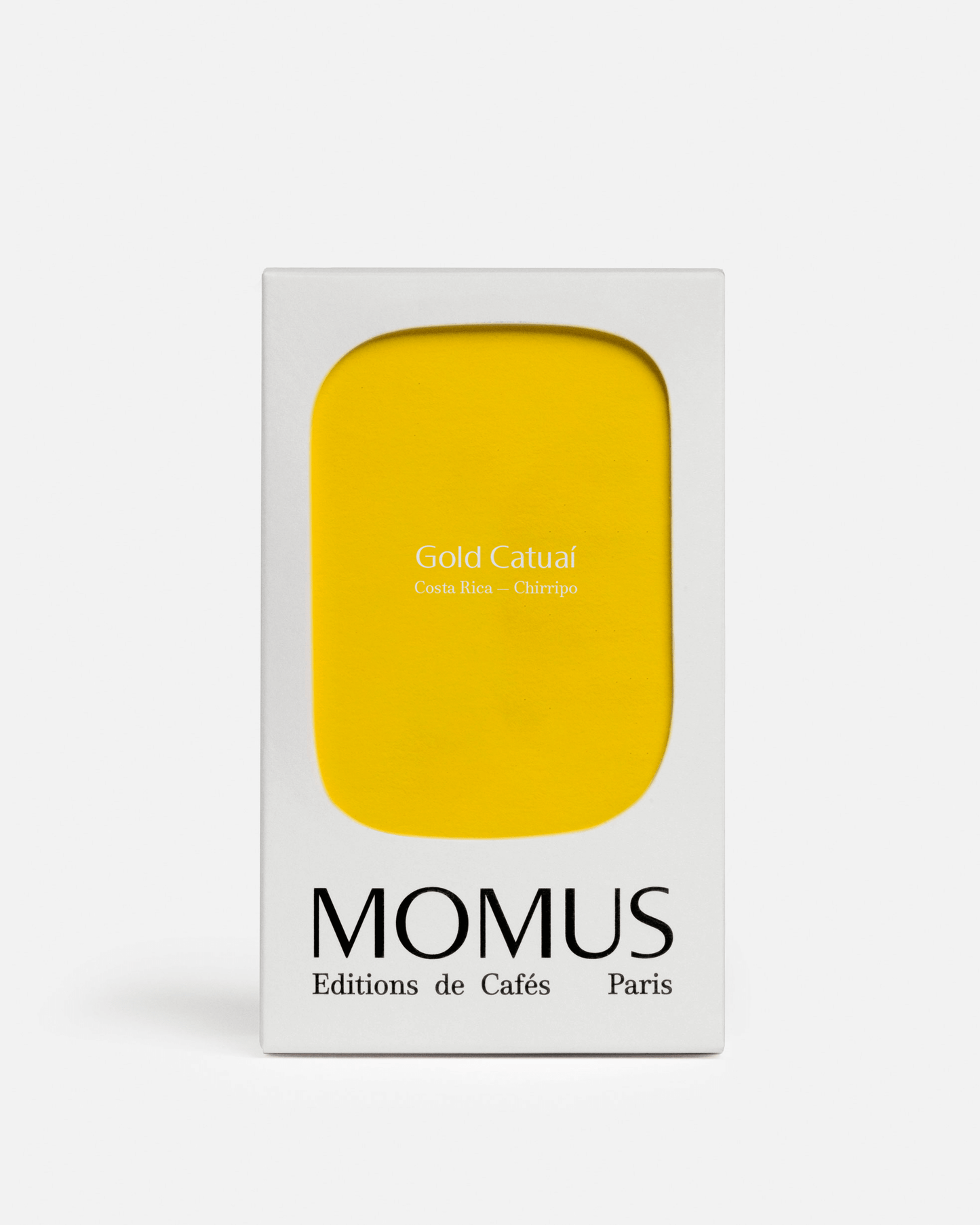 Packaging du café Gold Catuaí de Momus, éditions de cafés, avec façade jaune minimaliste.